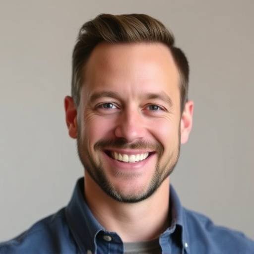 Headshot of Mark Johnson, looking happy and confident
